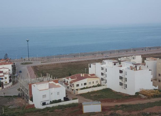 أرض محفظة 653 م2 بواد لاو مطلة على البحر