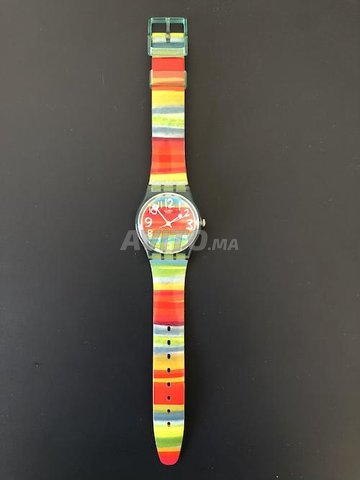 Montre femme SWATCH arc en ciel tanche Montres et Bijoux