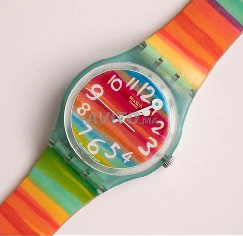 Montre femme SWATCH arc en ciel tanche Montres et Bijoux