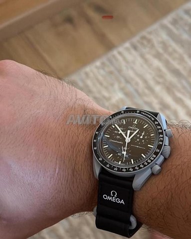 Swatch Omega original avec les documents 