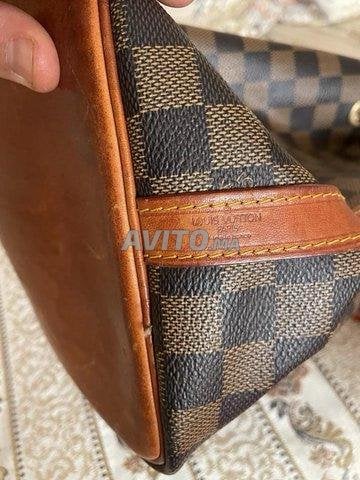 Vrai portefeuille hotsell louis vuitton