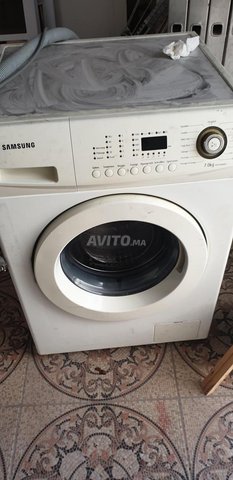 lave vaisselle en panneالة غسل الملابس