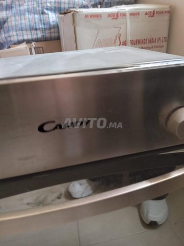 Four encastré candy Neuf