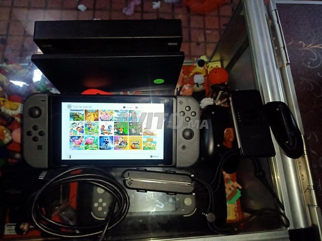 Nintendo switch v1 Flaché ( puce ) pleine de jeux 