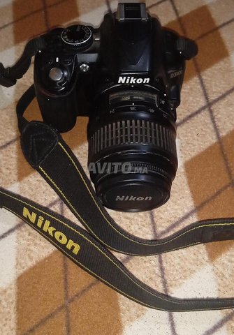 caméra Nikon d3100 ba9a n9iya 
