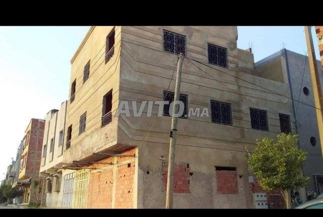 Maison de 5 appartement et une magasin à vendre  - 2