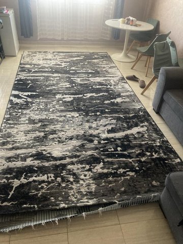 tres grand tapis epais