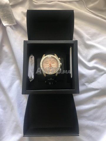 swatch omega mission to saturn avec les papiers