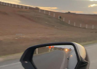 ارض 1100متر على طريق وطنية نصف مسيج