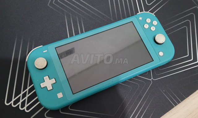 SWITCH LITE TURQUOISE  2 JEUX MINECRAFT ET FC 24