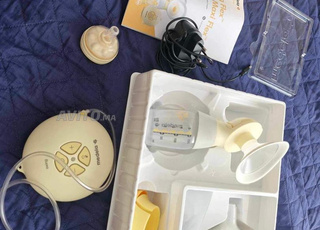 Tire Lait madela éléctrique en Tres bonne état 