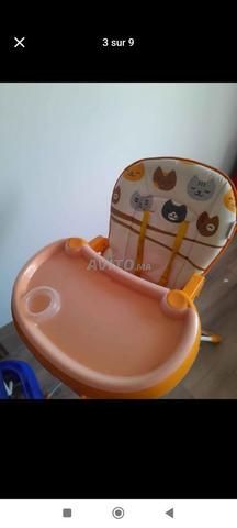 chaise haute , balançoire et roulette pour bébé 