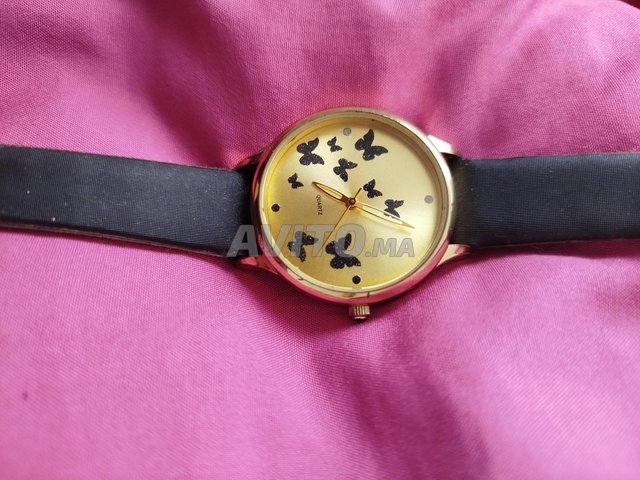 Montre femme avec des papillons 