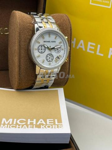 michel kors femme avec la boite complet