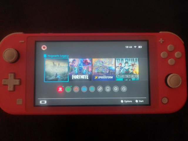 Nintendo switch lite en bonne état avec hogwarts 