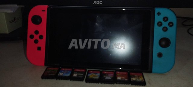 Nintendo Switch (tres bon état) avec 7 jeux 