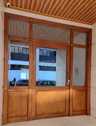 Porte démontée pour immeuble en bois massif frêne