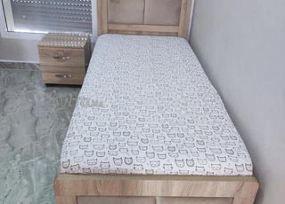 Chambre à coucher .