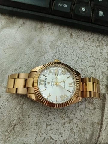 ساعة Rolex رجالية لون gold inoxydable