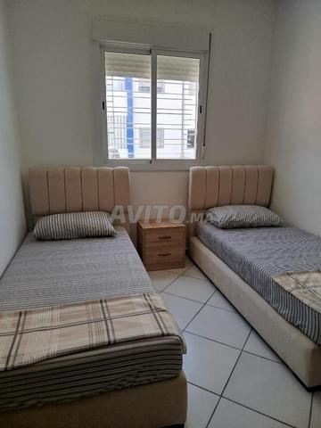 Appartement au centre-ville avec deux chambres, un salon, une cuisine et une salle de bain