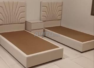 deux lits rembourrées