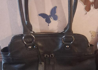 Sac noir vrai Cuir, presque neuf à vendre.