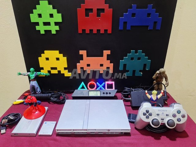 PlayStation 2 Argent Métallique plein de jeux