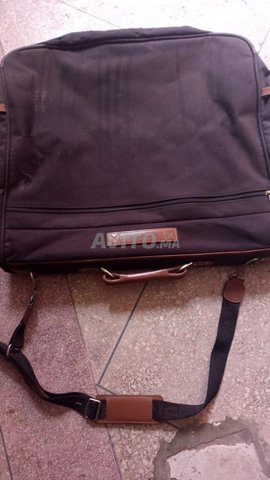  sac pour ranger costume marque LANCEL
