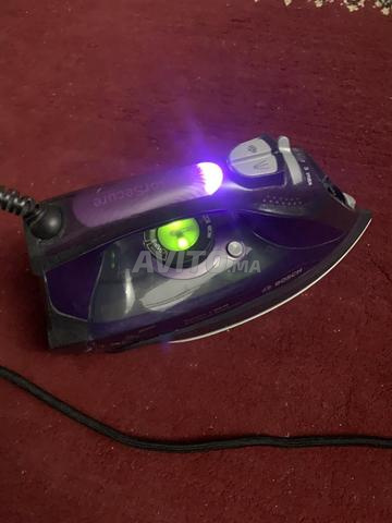 مصلوح الملابس Réparateur de vêtements