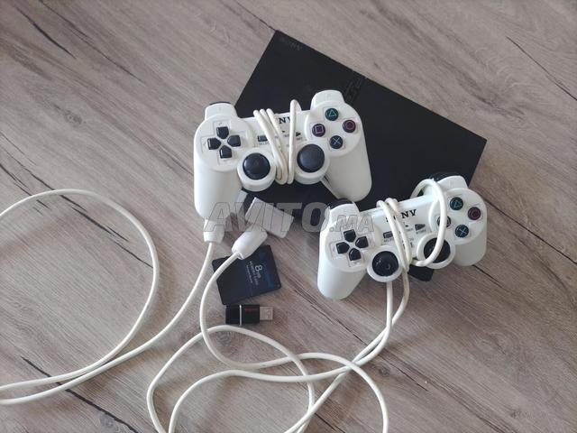 ps2 slime bl boîte n9i fih 31game w 2 manettat ori