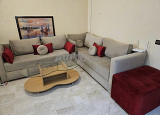 ensemble fauteuil en L avec pouffe 