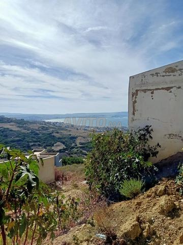 Terrain zone ville titré  avec une vue sur  mer 