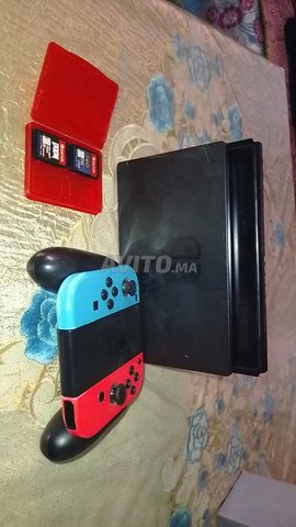 Nintendo switch oled plus 2 jeux