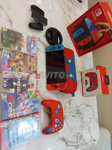 Nintendo Switch Oled complet plus des jeux