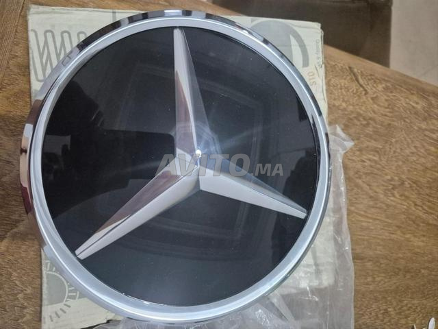 piece auto , symbole mercedes AMG made in germany