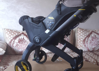 عربة أطفال ومقعد سيارة قابل للطي