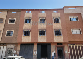 Maison avec 2 locaux commerciaux et 2 appartements