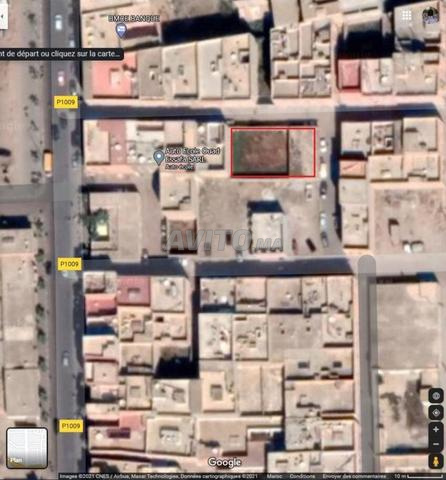 Terrain titré 400 m² – 2 façades – Centre Biougra