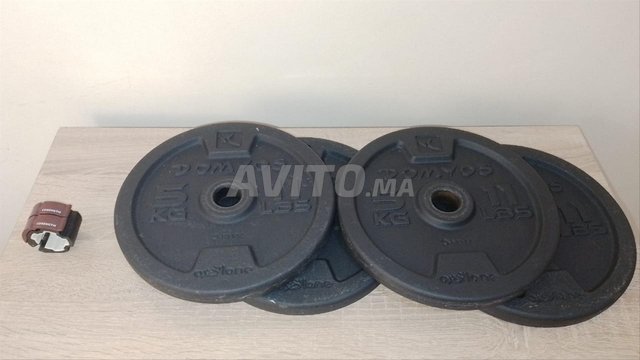 Barre de musculation, disques et stop disque