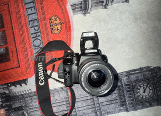 كاميرا كانون اي او اس 1000