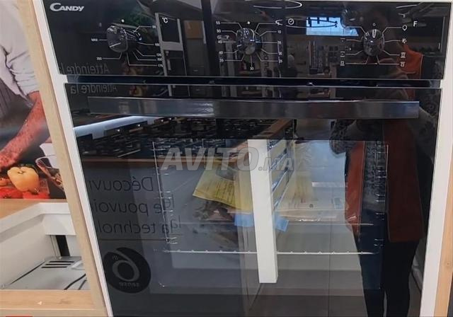 Four électrique intégré Candy, capacité 70 litres, couleur noire