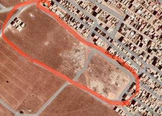 أرض بالقرب من مركز بئر جديد