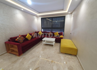 Salon moderne L avec table basse et pouffe