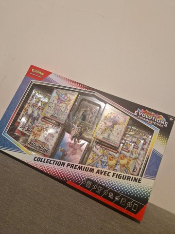 علبة بوكيمون تطور بريزماتيكي 11 بوستر