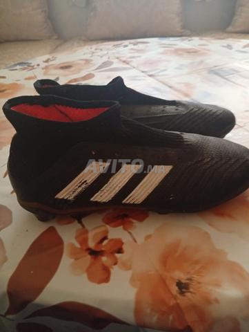 أديداس بريداتور 18 FG أسود وبرتقالي