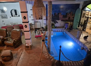 Lit dans dortoir à louer dans riad avec piscine