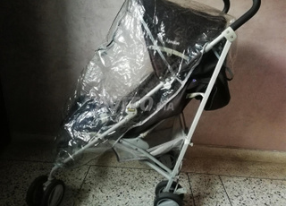 عربة أطفال مع غطاء للمطر