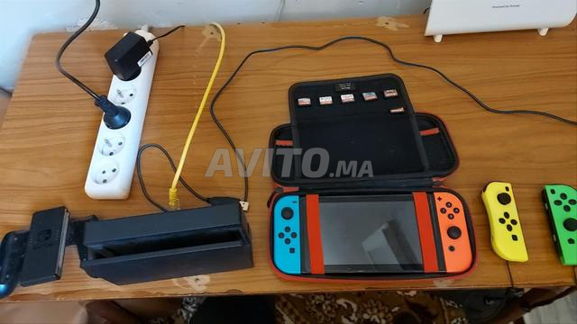 NINTENDO SWITCH مع 6 ألعاب و Joy-Con Grip