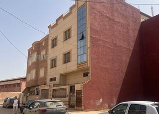 Terrain (derrière commissariat)