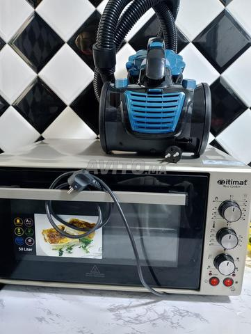 فرن كهربائي ومكنسة كهربائية منزلية